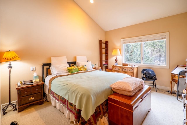 bedroom featuring light colored carpet, vaulted ceiling, and baseboards