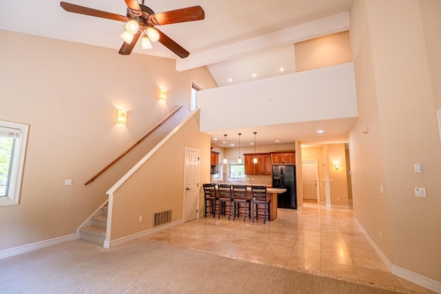 159 Fairway Blvd, Kalispell, MT 59901 - unfurnished living room with beam ceiling, stairs, high vaulted ceiling, ceiling fan, and recessed lighting