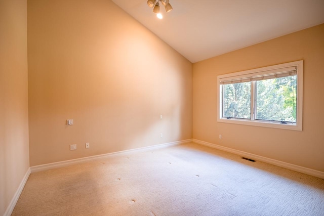 159 Fairway Blvd, Kalispell, MT 59901 - unfurnished room featuring light colored carpet and vaulted ceiling