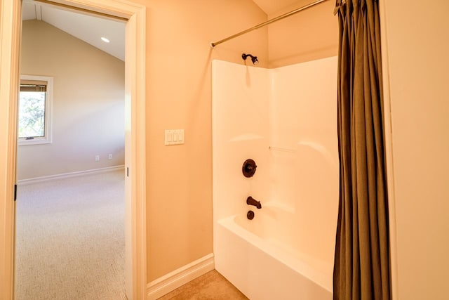 159 Fairway Blvd, Kalispell, MT 59901 - bathroom featuring shower / bath combination with curtain and vaulted ceiling