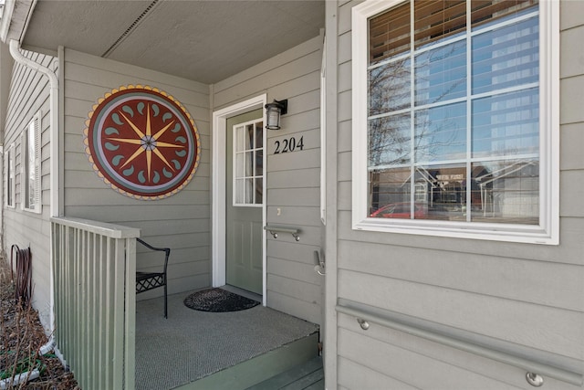 view of exterior entry featuring a porch