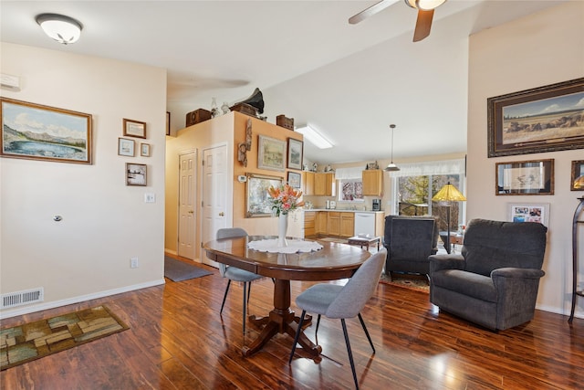 dining room with dark wood-style flooring, lofted ceiling, visible vents, a ceiling fan, and baseboards