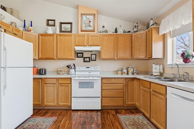 kitchen featuring light countertops, vaulted ceiling, a sink, white appliances, and under cabinet range hood