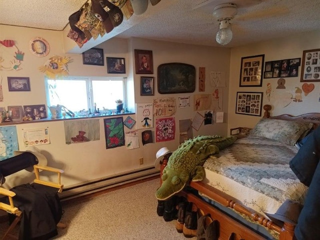 bedroom with a textured ceiling, a baseboard heating unit, and carpet floors