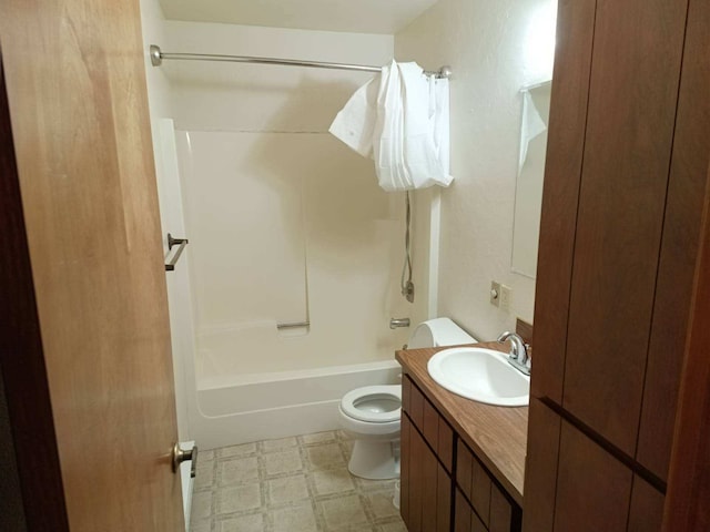 full bath with shower / bath combination, vanity, toilet, and tile patterned floors