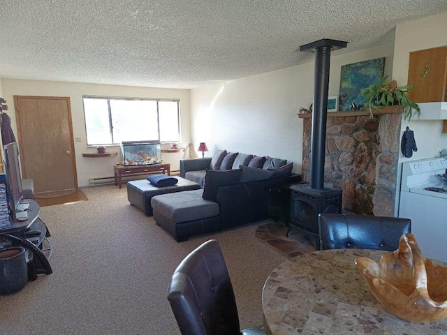 living area featuring a textured ceiling, carpet, and a wood stove