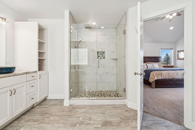 full bathroom featuring recessed lighting, a stall shower, connected bathroom, vanity, and ceiling fan