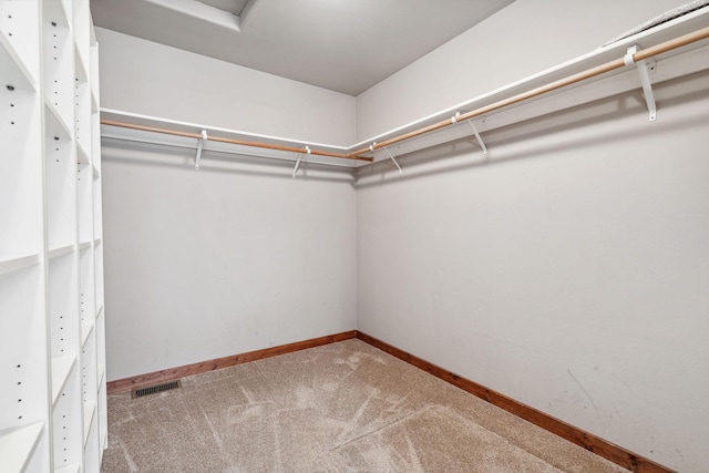 walk in closet with carpet flooring and visible vents