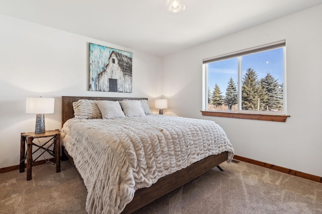 carpeted bedroom with baseboards