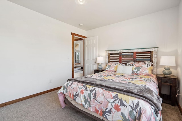 carpeted bedroom with baseboards