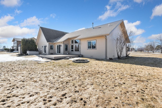 back of house with a wooden deck