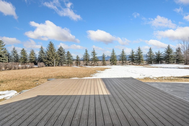 wooden deck with a yard