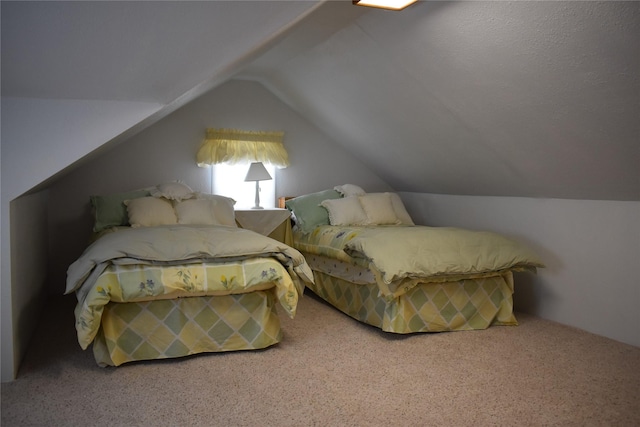 carpeted bedroom featuring vaulted ceiling