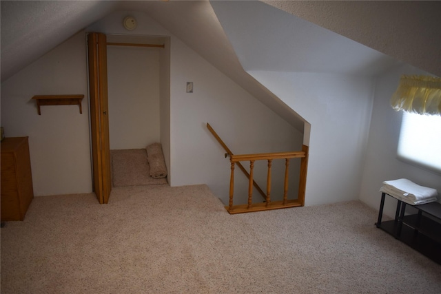 bonus room featuring carpet floors and lofted ceiling