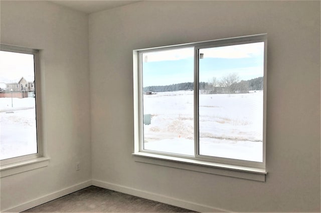 empty room featuring baseboards