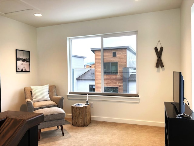 living area with recessed lighting, carpet, and baseboards