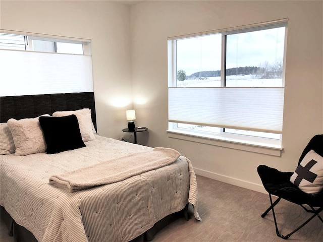 carpeted bedroom with baseboards