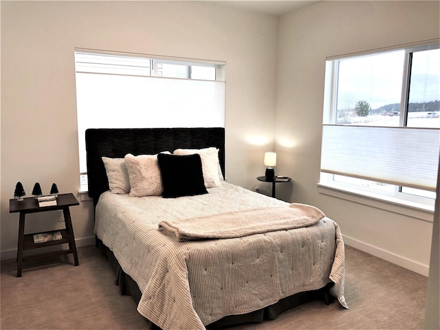 carpeted bedroom with baseboards