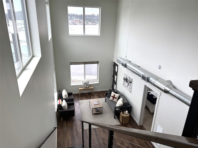 264A Blackberry Loop Unit A, Whitefish, MT 59937 - living room featuring wood finished floors and a towering ceiling