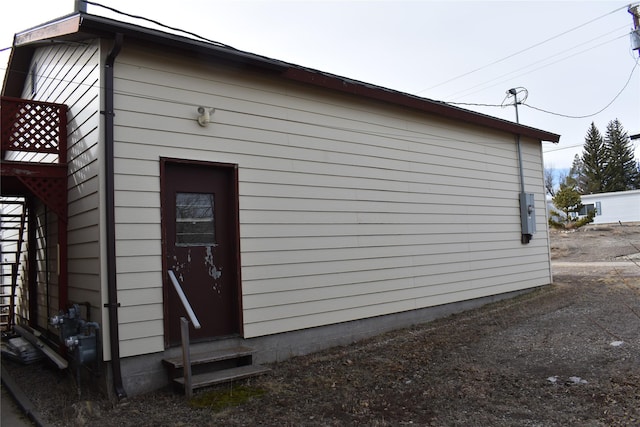 view of side of home featuring entry steps