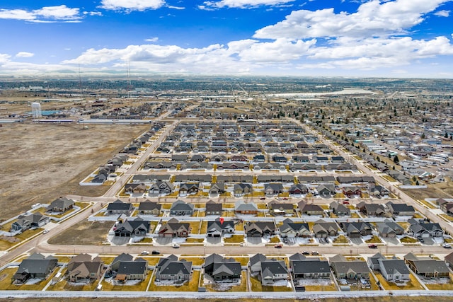 birds eye view of property with a residential view