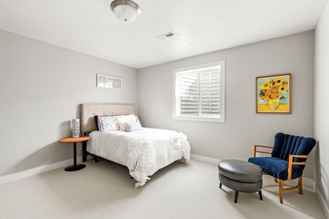 bedroom with visible vents, baseboards, and carpet