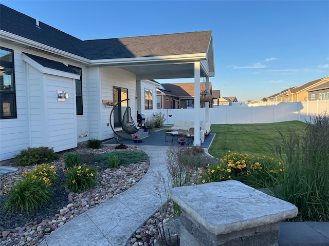 view of yard featuring a patio and fence