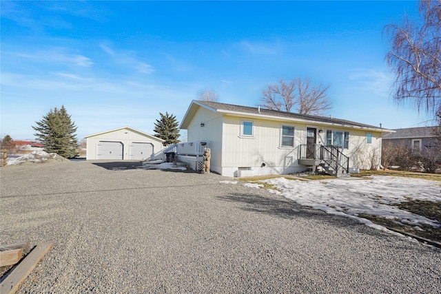 view of front of property with an outbuilding, a detached garage, and crawl space