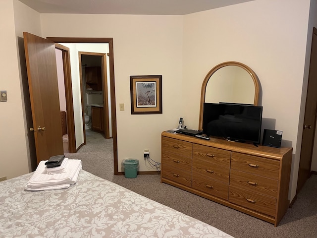 bedroom featuring baseboards and carpet floors