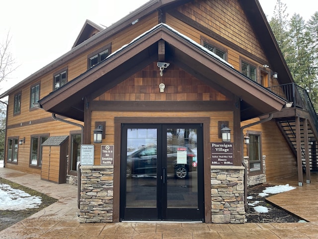 view of exterior entry featuring stone siding