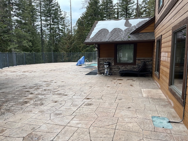 view of patio / terrace featuring fence