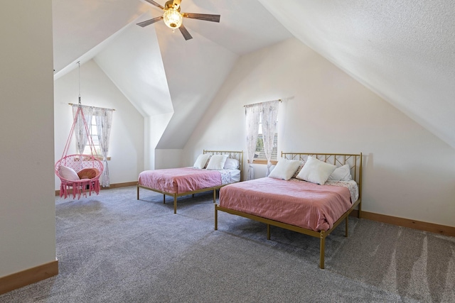 carpeted bedroom with ceiling fan, baseboards, and vaulted ceiling