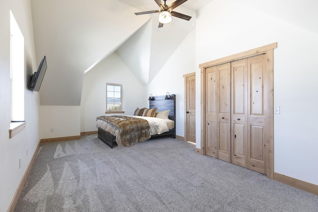 carpeted bedroom featuring vaulted ceiling, a ceiling fan, and baseboards