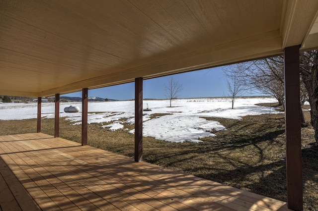 view of snow covered deck