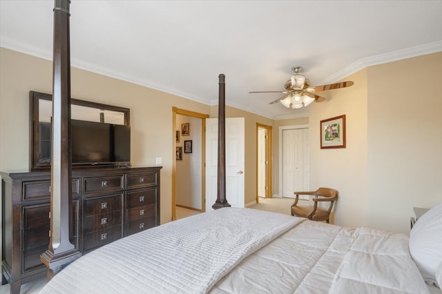 bedroom featuring a closet, ceiling fan, and ornamental molding