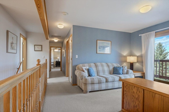 living area with light colored carpet