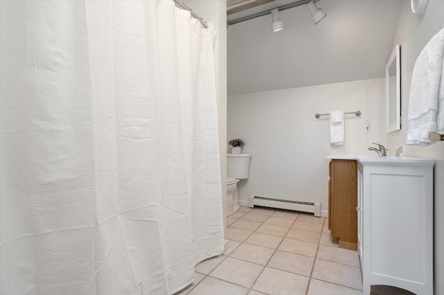 bathroom with tile patterned floors, toilet, track lighting, a baseboard radiator, and vanity