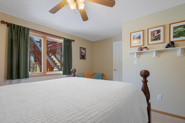 bedroom featuring baseboards, carpet, and a ceiling fan