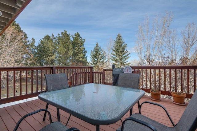 wooden terrace featuring outdoor dining space