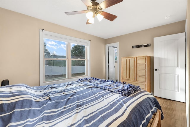 bedroom with wood finished floors and ceiling fan