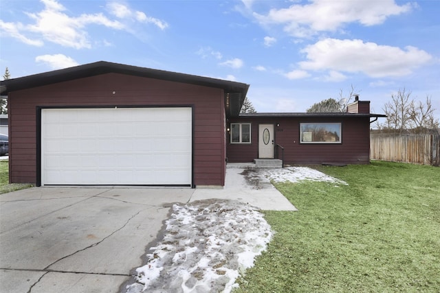 single story home with fence, driveway, an attached garage, a chimney, and a front lawn