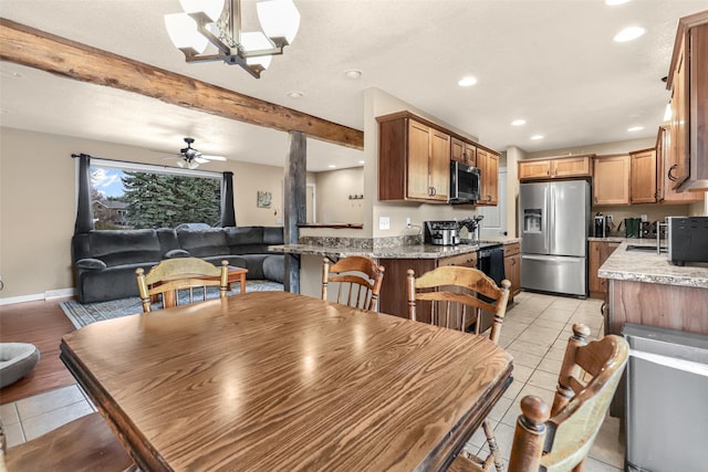 dining space featuring light tile patterned floors, beamed ceiling, recessed lighting, and ceiling fan with notable chandelier