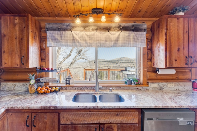 kitchen featuring brown cabinetry, wooden ceiling, stainless steel dishwasher, and a sink