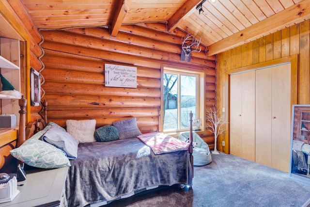 carpeted bedroom with a closet, wood ceiling, and vaulted ceiling with beams