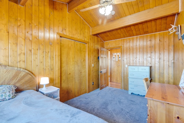 carpeted bedroom featuring wooden walls, ceiling fan, wood ceiling, lofted ceiling with beams, and a closet