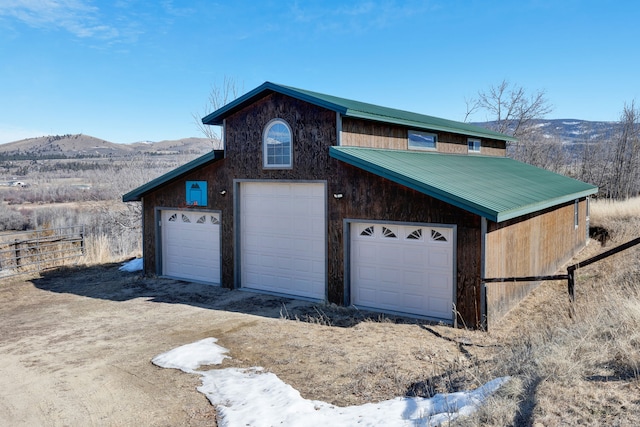 detached garage with a mountain view