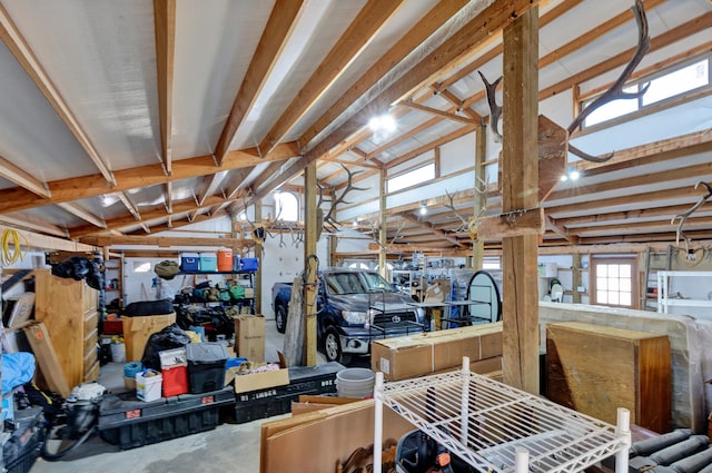 miscellaneous room with concrete floors and vaulted ceiling