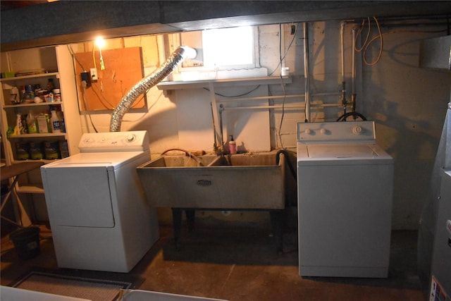 laundry area with washer and dryer, laundry area, and a sink