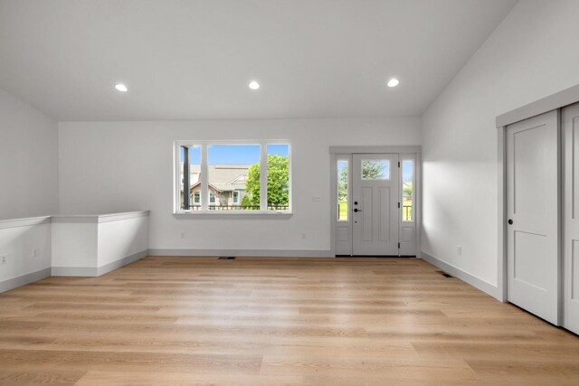 57 Hidden Cedar Loop, Columbia Falls, MT 59912 - entryway featuring light wood-style flooring, recessed lighting, and vaulted ceiling