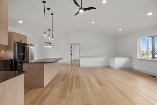 57 Hidden Cedar Loop, Columbia Falls, MT 59912 - kitchen with black refrigerator with ice dispenser, modern cabinets, light brown cabinetry, vaulted ceiling, and a ceiling fan